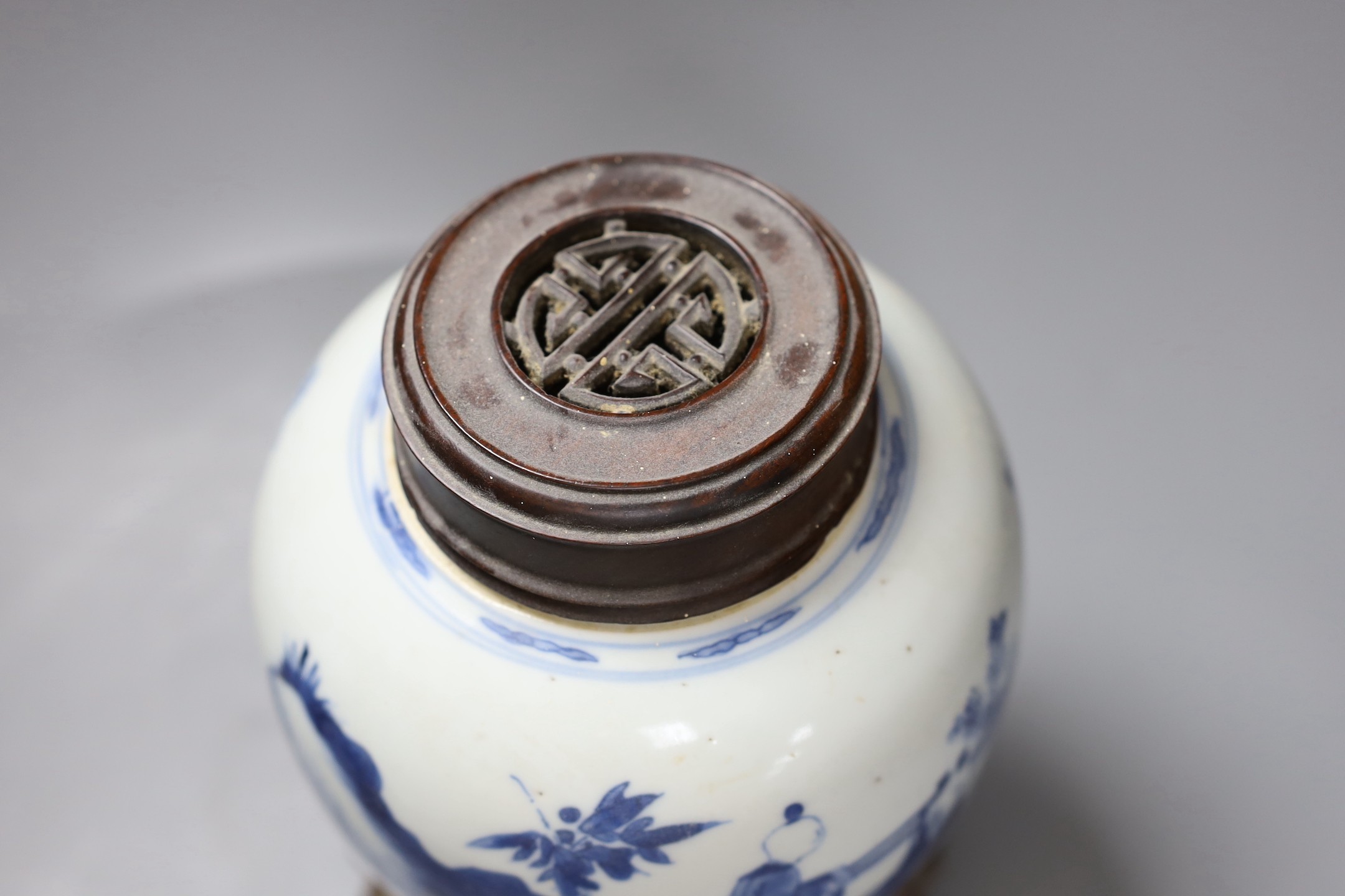 A Chinese blue and white 'boys' jar, 19th century, wood cover and stand, total height 24cm high